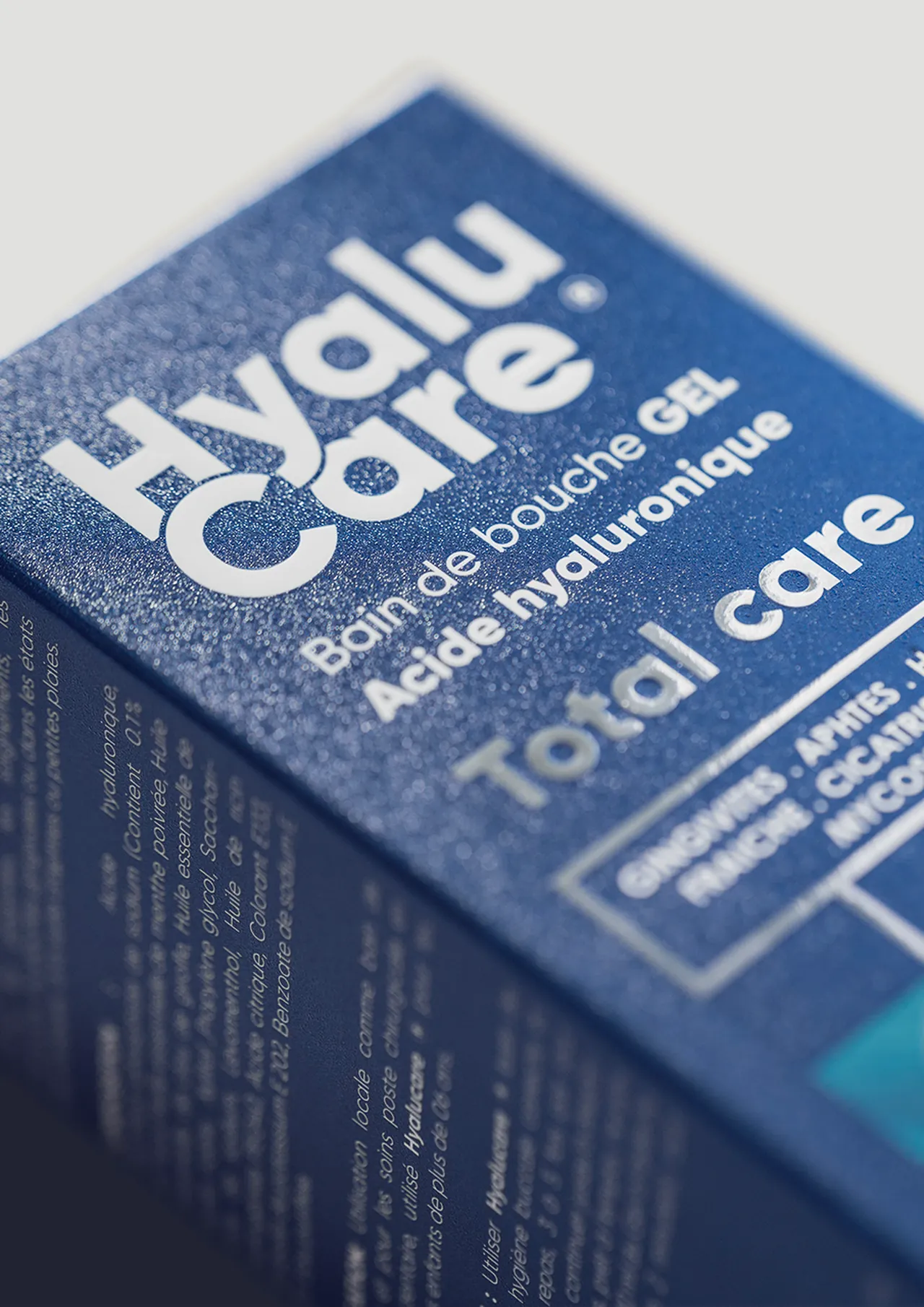 HyaluCare for Natural Solutions, printed — metallic blue board, the name and “Total care” in silver foil