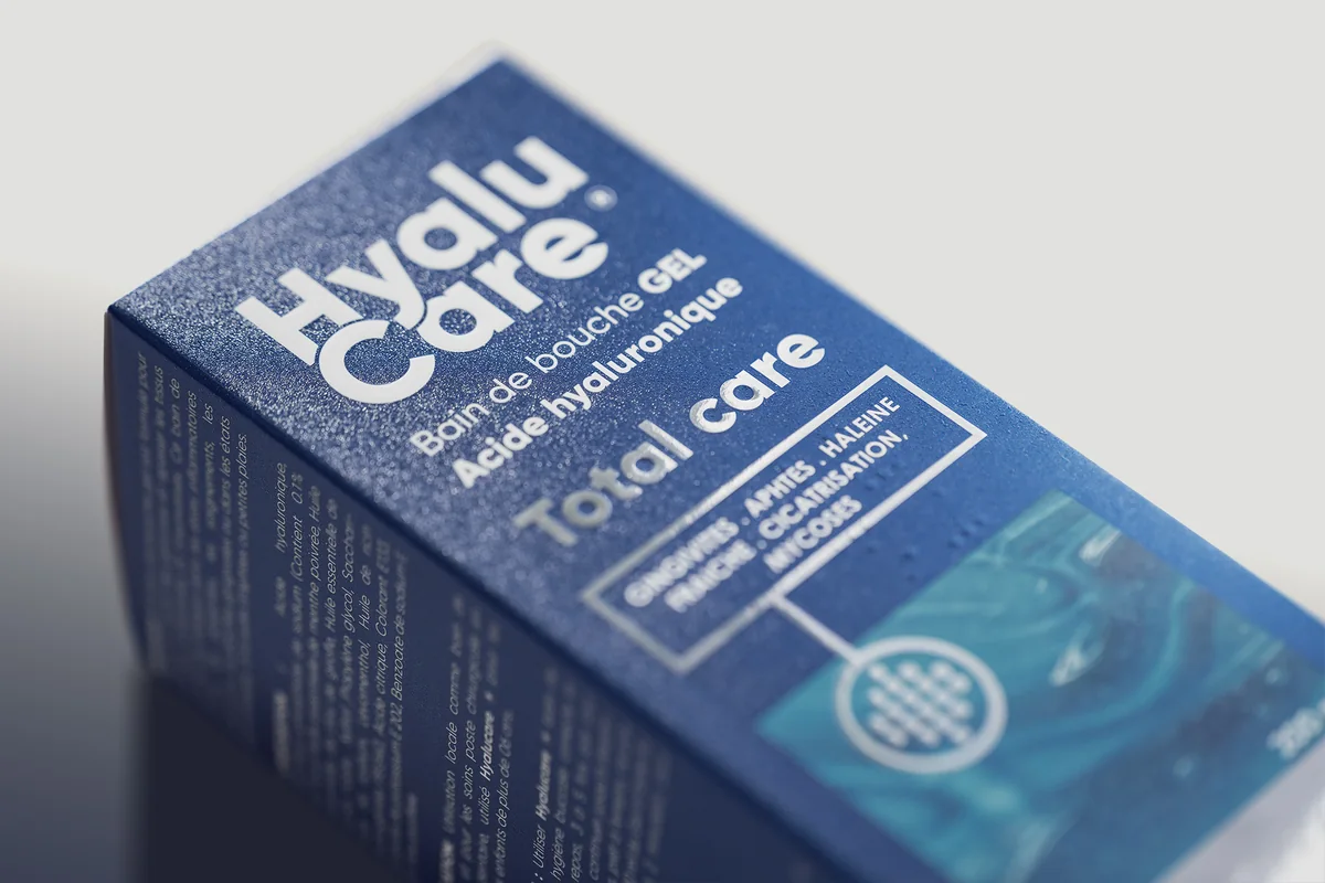 The HyaluCare carton, close up: metallic blue board with silver foil lettering